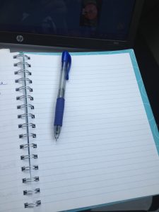 An open notebook and pen.