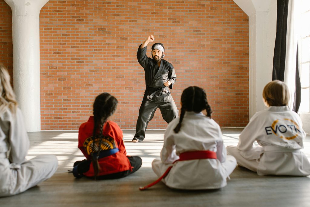Man Wearing a Black Taekwondo Uniform