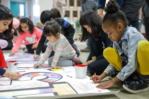 Children drawing together at childcare.