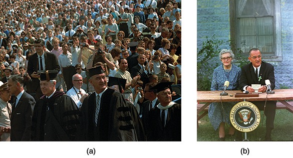 A two-part color image related to Lyndon B. Johnson. (a) shows Lyndon B. Johnson and other men in academic regalia walking through a large crowd of people, likely at a graduation ceremony. (b) shows Lyndon B. Johnson and his childhood schoolteacher, Kate Deadrich Loney, seated at a table with the presidential seal affixed to it, outdoors with a microphone and papers in front of them.