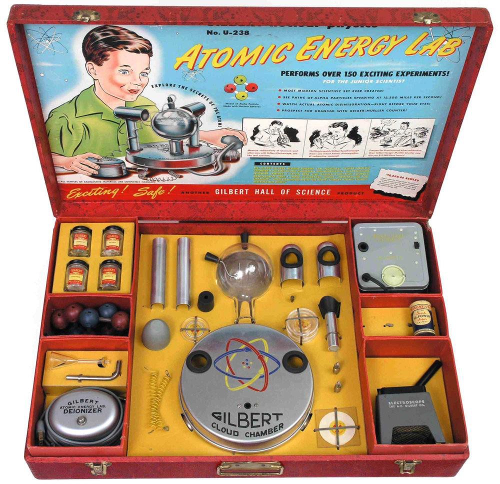 Photograph of the Atomic Energy Lab revealing all the equipment packaged within a red case.